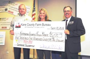 Kane County Farm Bureau President Joe White, right, presented a check to Northern Illinois Food Bank’s Nichole Okapal, Meeting Space and Volunteer Coordinator, and Steve Ericson, Director of Food Procurement, to help them in their quest to stamp out hunger in Kane County and Northern Illinois communities. Proceeds from KCFB’s Centennial Celebration, combined with recent KCFB hunger relief efforts, pushed the association over its hunger relief goal – the equivalent of one million meals in cumulative hunger relief to local food pantries.